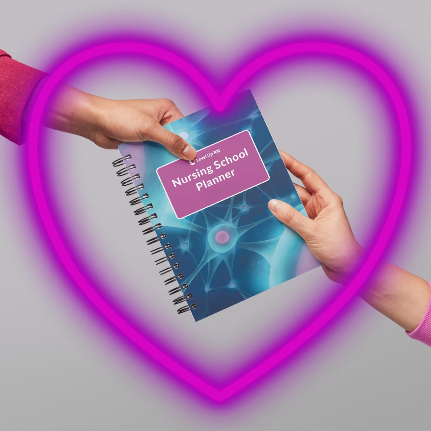 Someone handing someone Nursing School Study Planner as a gift