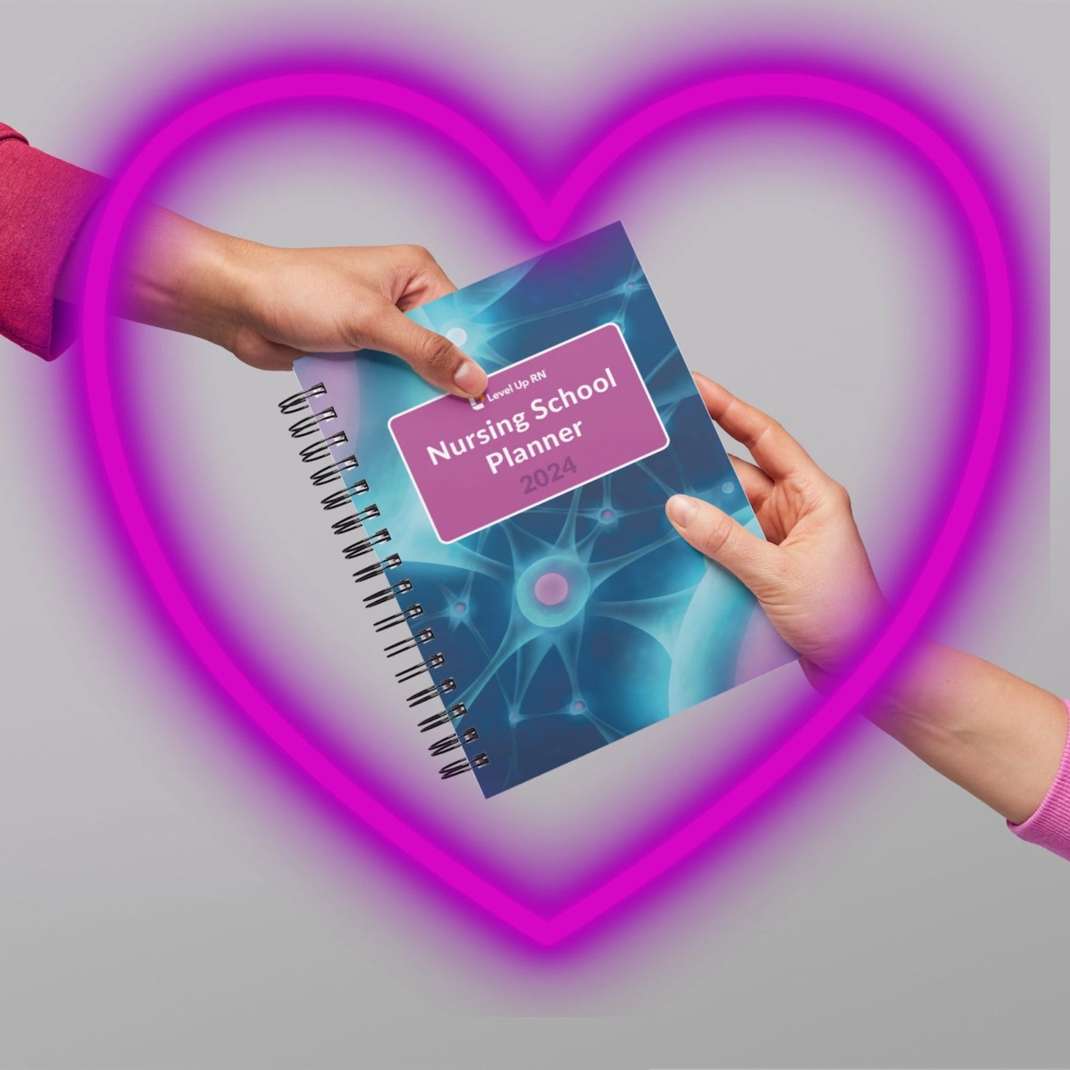 Someone handing someone Nursing School Study Planner as a gift